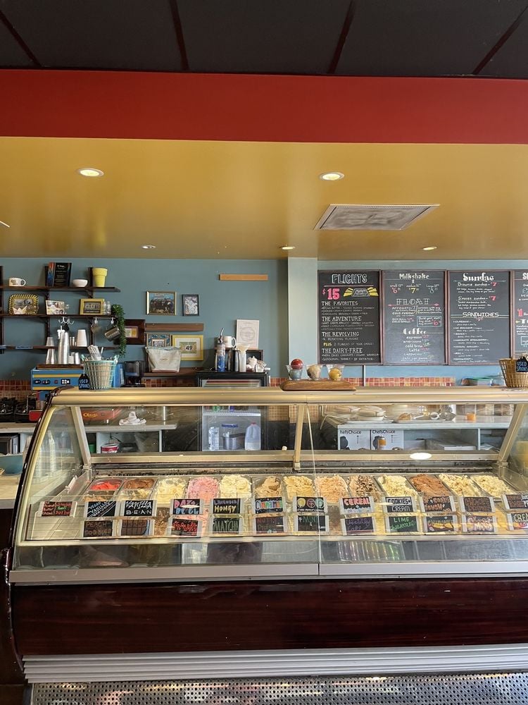 Ice cream counter with a variety of colorful flavors at Betty Rae's Ice Cream.