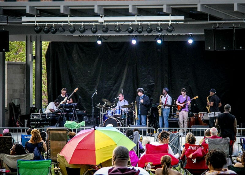 A local band performing on stage at Washington Park.