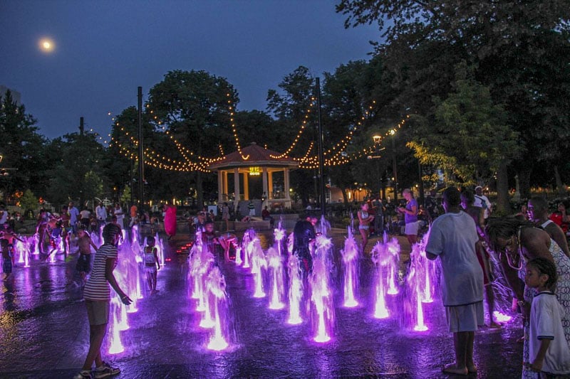Washington Park showcases a vibrant nighttime hub, blending music, community, and nature.