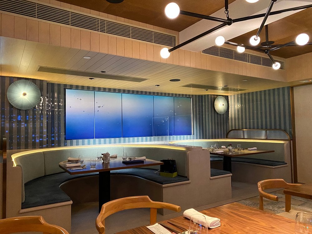 Chic and cozy booth seating at Hansik Goo with soft lighting and modern decor.