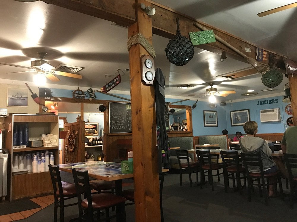 Cozy nautical-themed dining area at JL Trent’s Seafood and Grill.