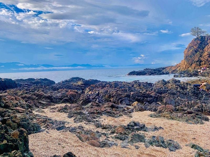 A serene landscape featuring Lahung Rock Formation against a backdrop of untouched nature