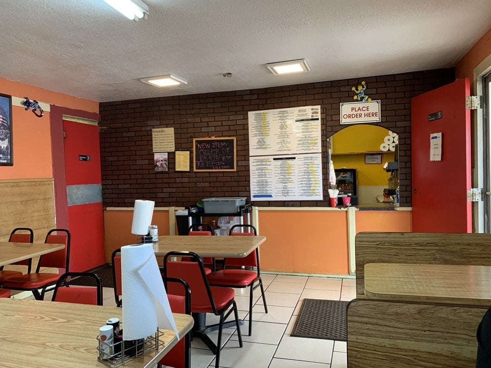 Simple interior of Taqueria El Crucero with a walk-up order window.