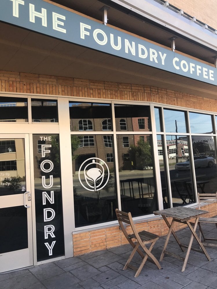 Street view of The Foundry coffee shop with outdoor seating.