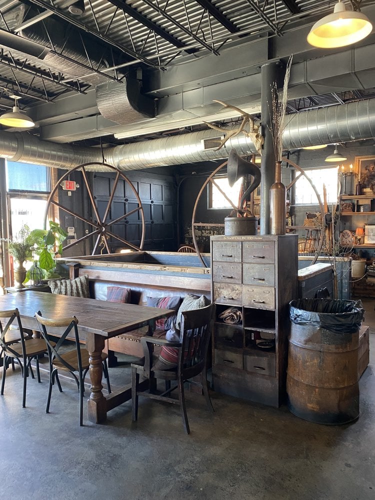 Cozy, rustic dining area with wooden furniture and vintage decor at The Russell.