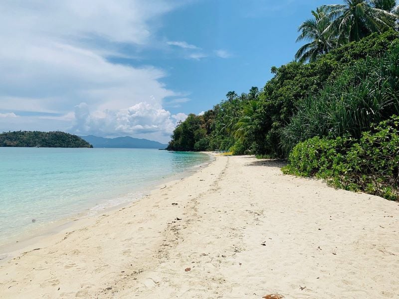 Immerse yourself in the untouched allure of Tiamban Beach, where time stands still