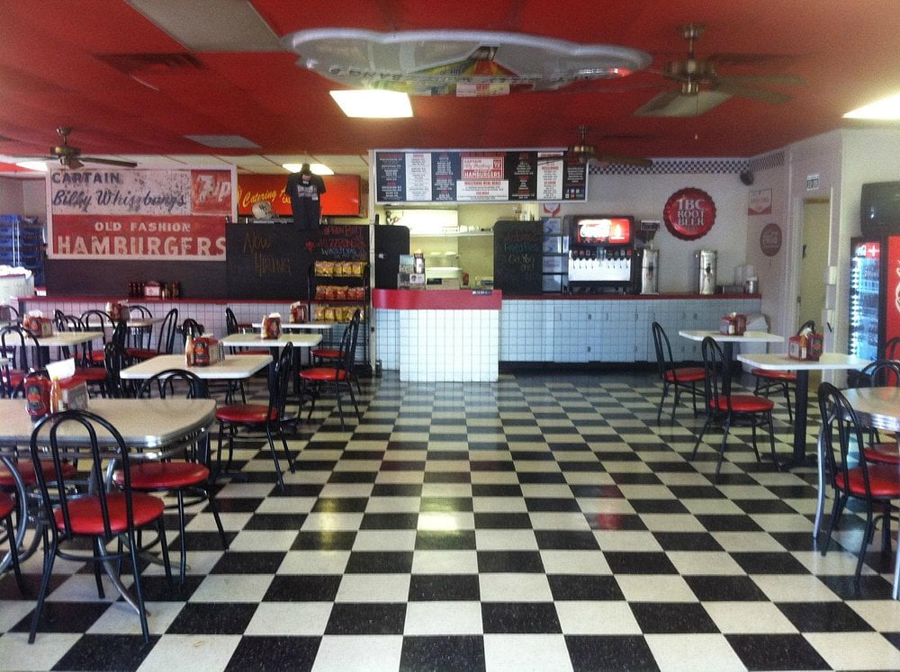 Retro-style dining room at Whizzbang's with checkered floors.