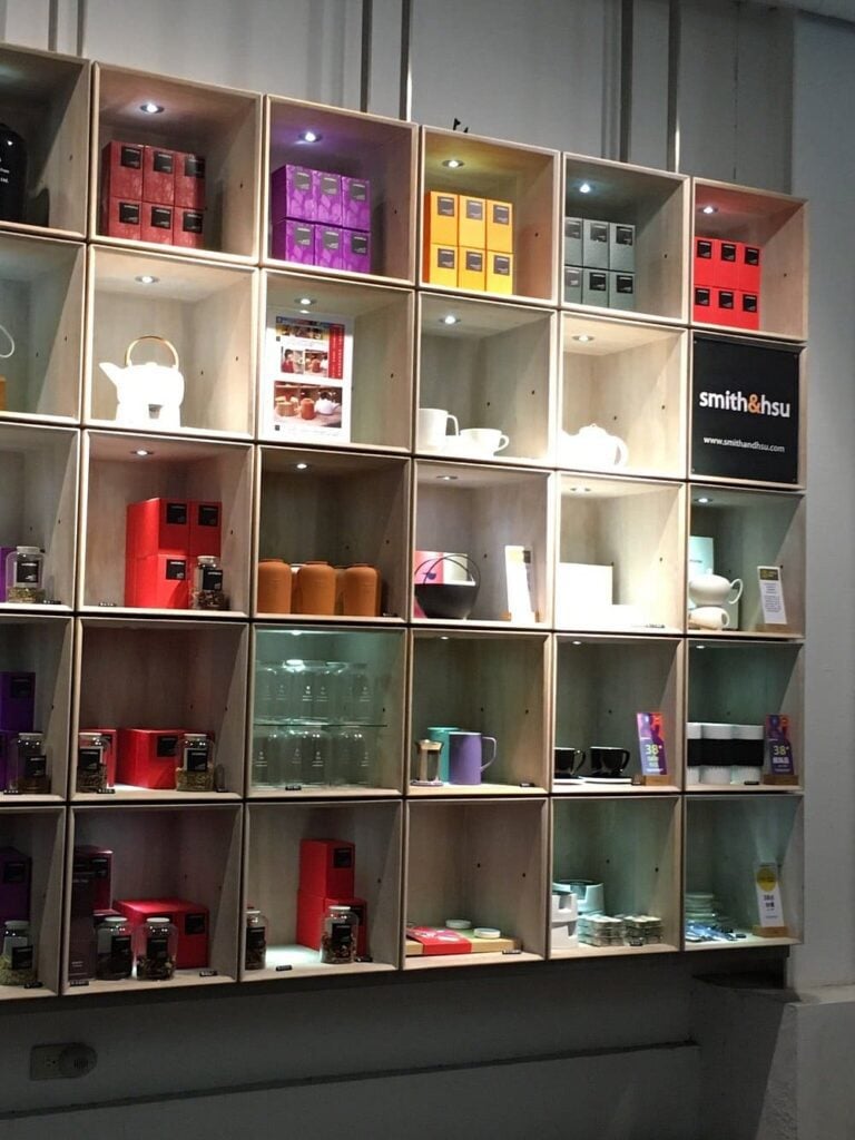 Display shelves at Smith & Hsu showcasing teas, teapots, and tea accessories.