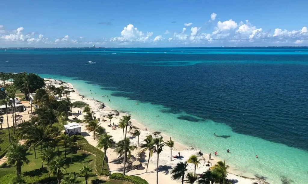 Aerial view of Cancun’s white sand beach and turquoise water.