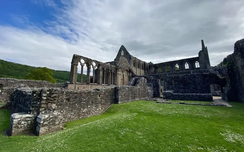 Stone ruins and pointed arches at Tintern Abbey.