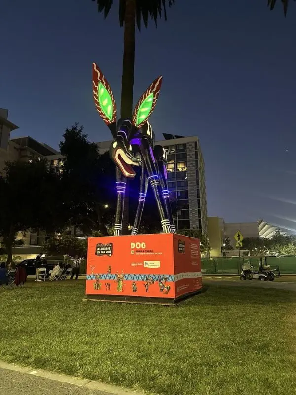 A tall illuminated dog sculpture featured at San Jose Jazz Summer Fest.