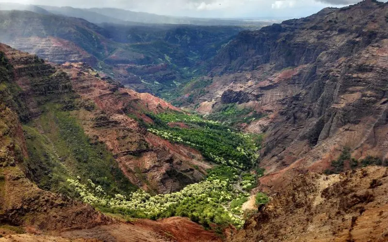 A deep red and green canyon view in Waimea.