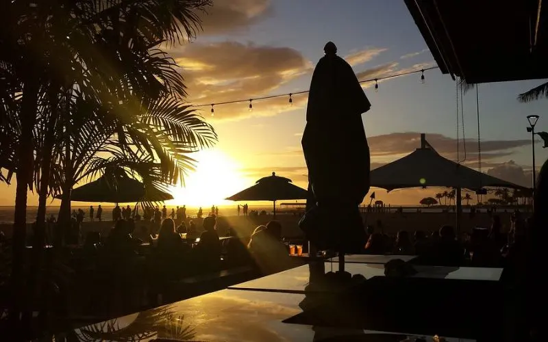 Sunset view from Duke’s Waikiki Barefoot Bar overlooking the beach.