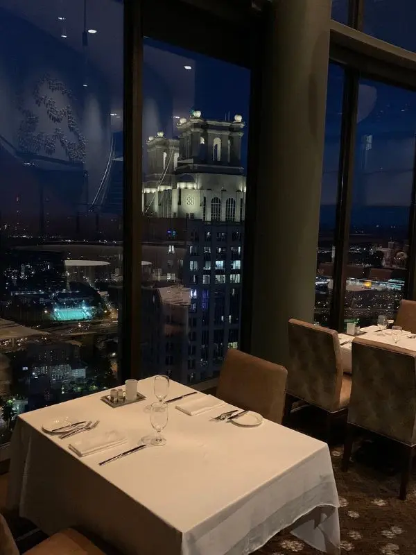 Night city view from a dining table at the Sun Dial Restaurant.