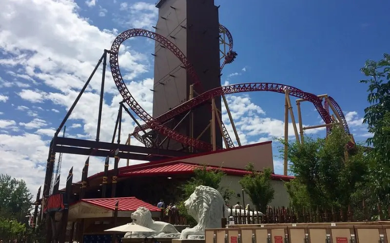 A roller coaster with a looping red track, located in Farmington, Utah.