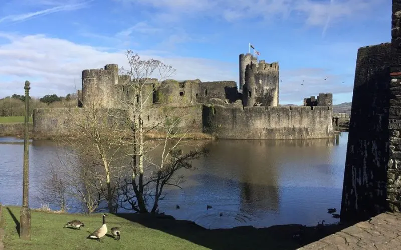Stone fortress surrounded by water at Caerphilly Castle.