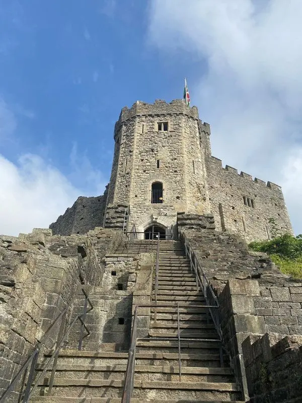 Steep stone steps leading up to Cardiff Castle tower.