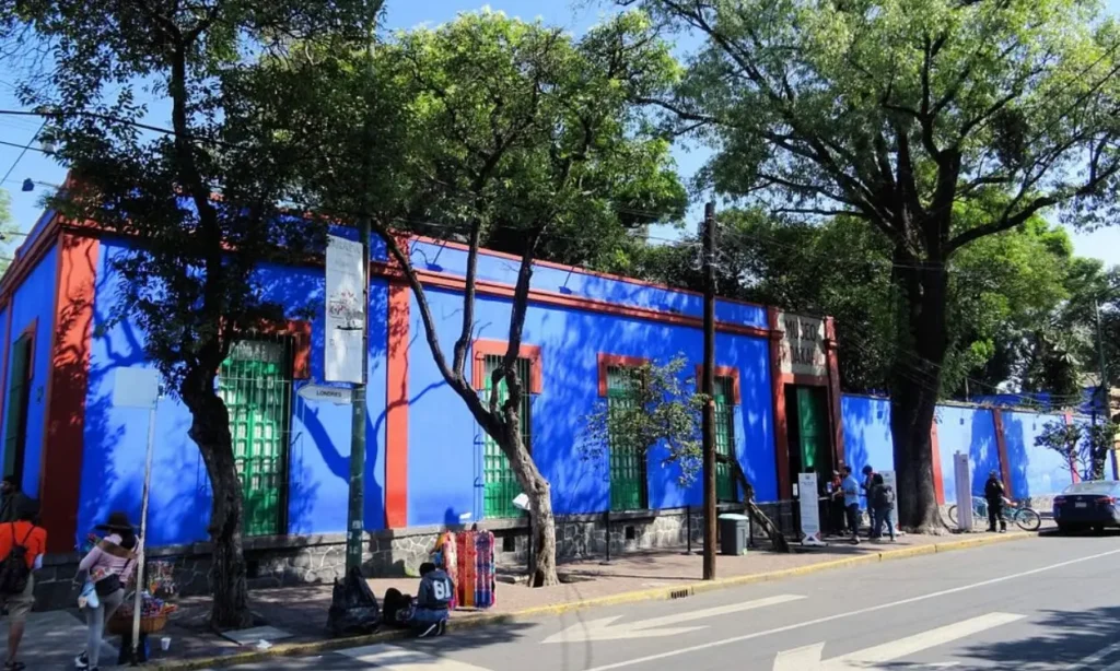 Bright blue and red exterior of a building in Mexico City.
