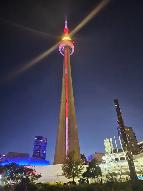 The CN Tower lit up at night in Toronto.
