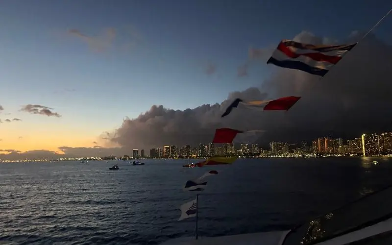 Honolulu skyline at dusk seen from the Pacific Star Sunset Cruise.