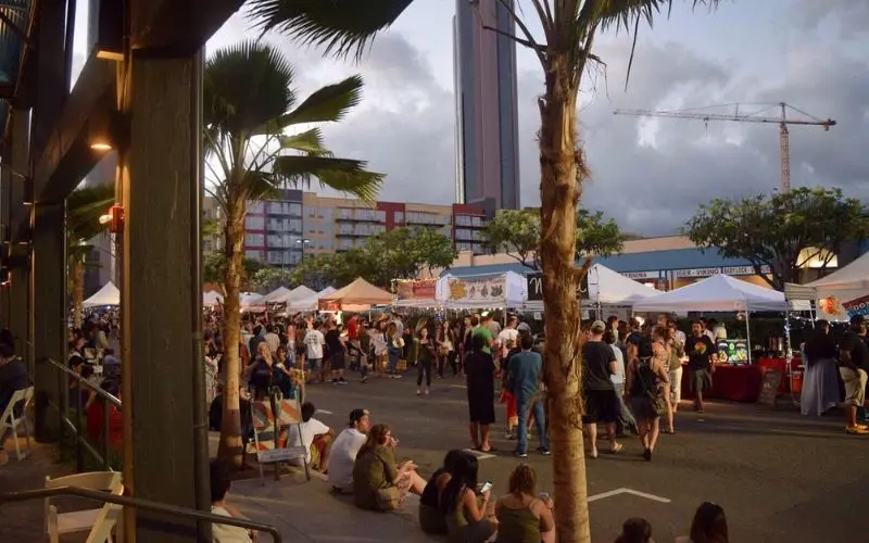 Crowds browsing food and craft stalls at Honolulu Night Market.