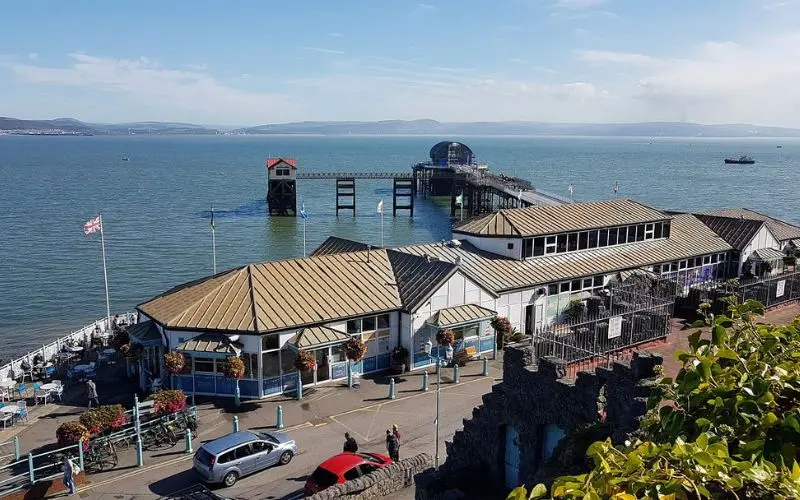 Seaside pier and waterfront buildings at Mumbles.