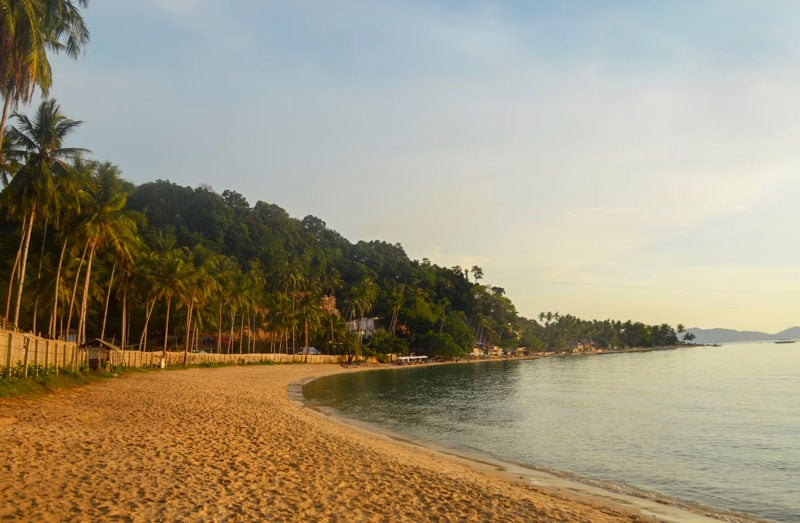 Sunset at Las Cabanas Beach, also called Marimegmeg Beach, is a must in El Nido for its stunning evening vistas.