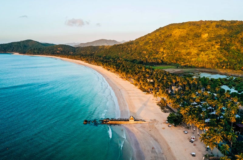 Nacpan Beach offers a serene escape with its golden sands, crystal-clear waters, and lush surroundings.