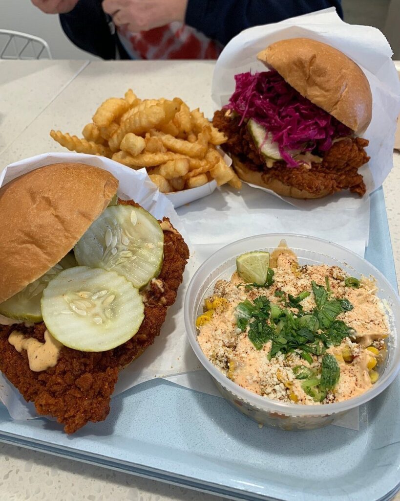 Crispy chicken sandwiches and seasoned fries served at Pretty Bird.