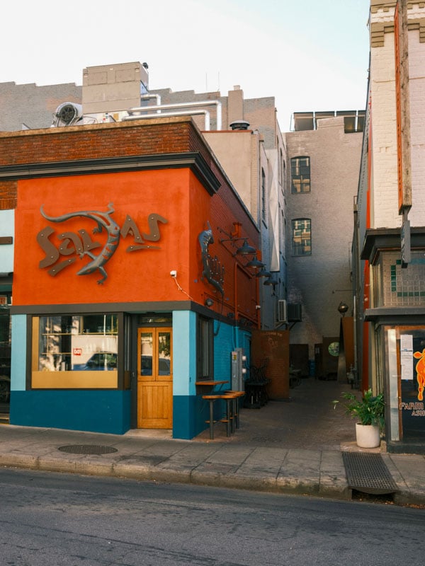 The exterior of a colorful and vibrant restaurant named Salsas in Asheville.