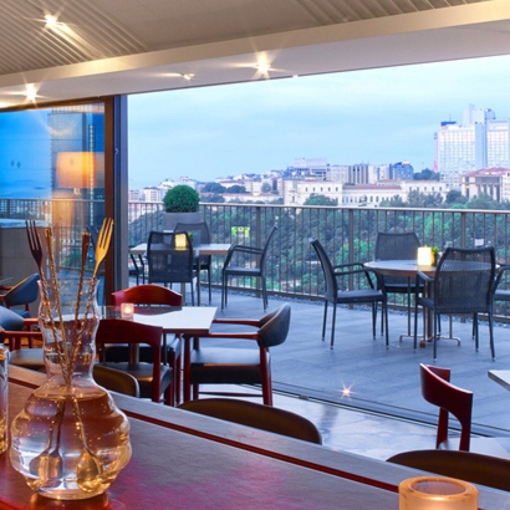 Modern rooftop terrace at Spago with views over the city.