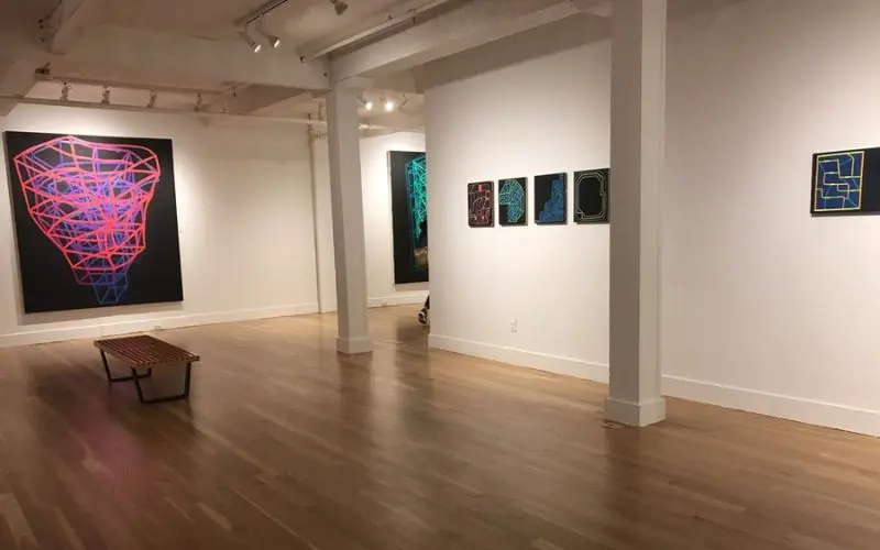 The Boulder Museum of Contemporary Art displays colorful modern paintings inside a gallery.