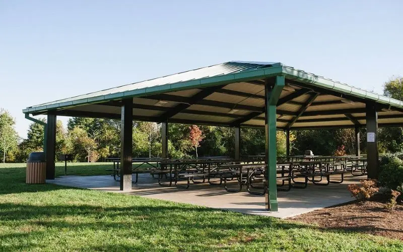 Open-air pavilion with picnic tables in a Farragut park.