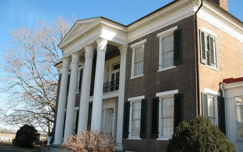Historic brick mansion with white columns in Spring Hill.