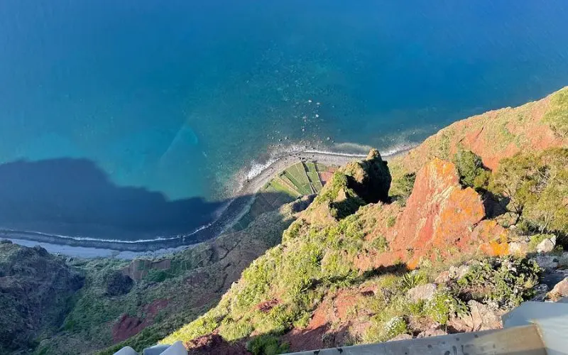 A dramatic view down the cliffs to the ocean from Cabo Girão Skywalk.
