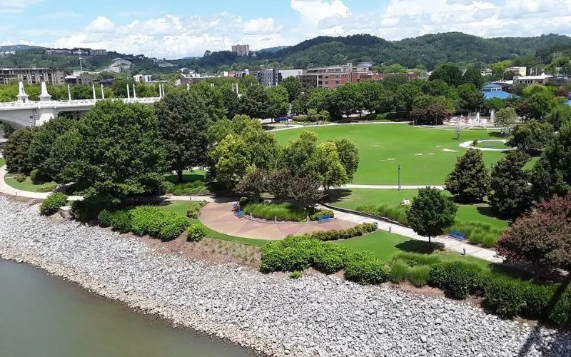 Chattanooga riverfront park with trees and walking paths.