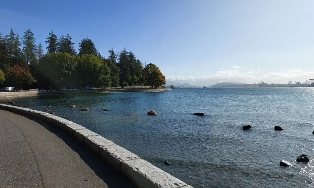 A seawall path curves along the water’s edge in Vancouver.