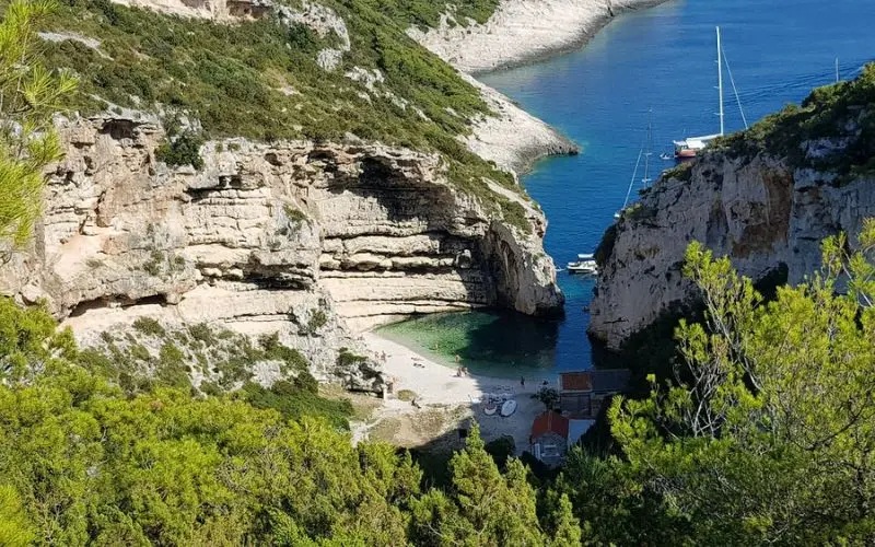 A hidden beach surrounded by cliffs at Stiniva Cove in Croatia.