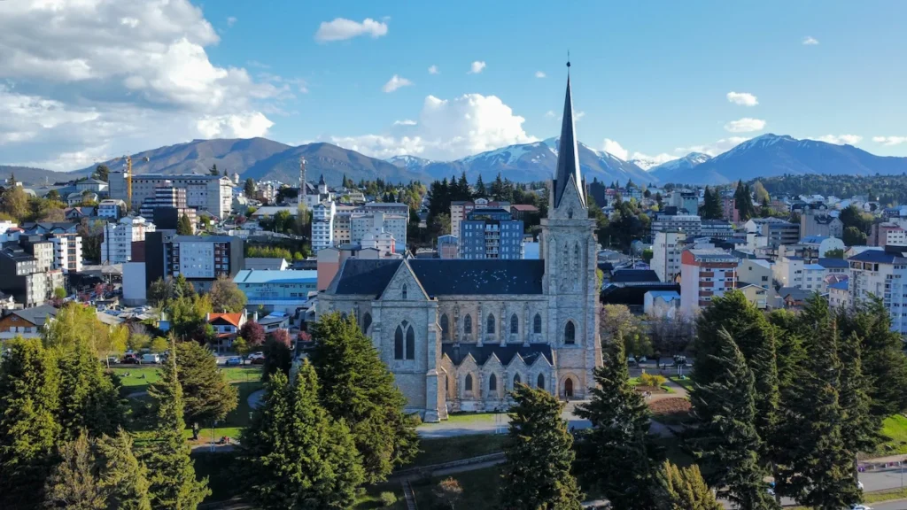 Cathedral of Our Lady of Nahuel Huapi with snow-capped Andes mountains in the background