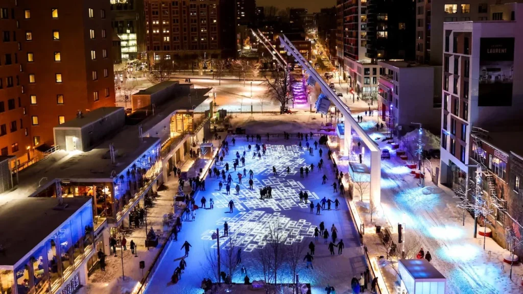 Night view of the illuminated Esplanade Tranquille ice rink in Montreal