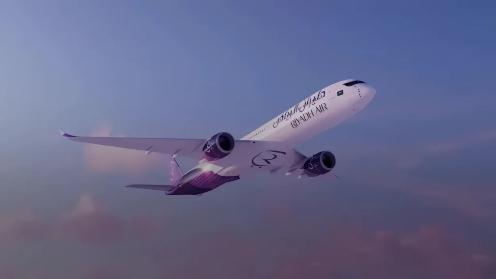 Riyadh Air Boeing 787-9 Dreamliner flying through a twilight sky