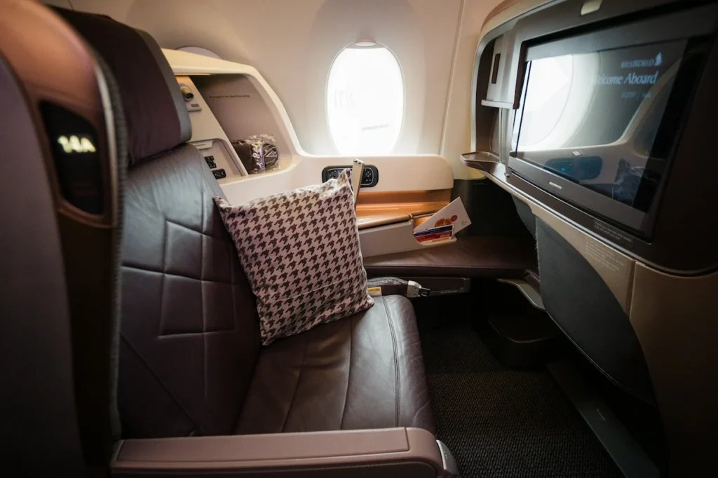 Singapore Airlines business class seat with an inflight entertainment
