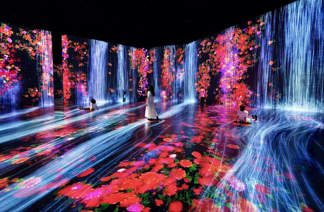 Interactive digital waterfall and flower installation at Superblue Miami, one of the top things to do in Miami for young adults seeking immersive art experiences