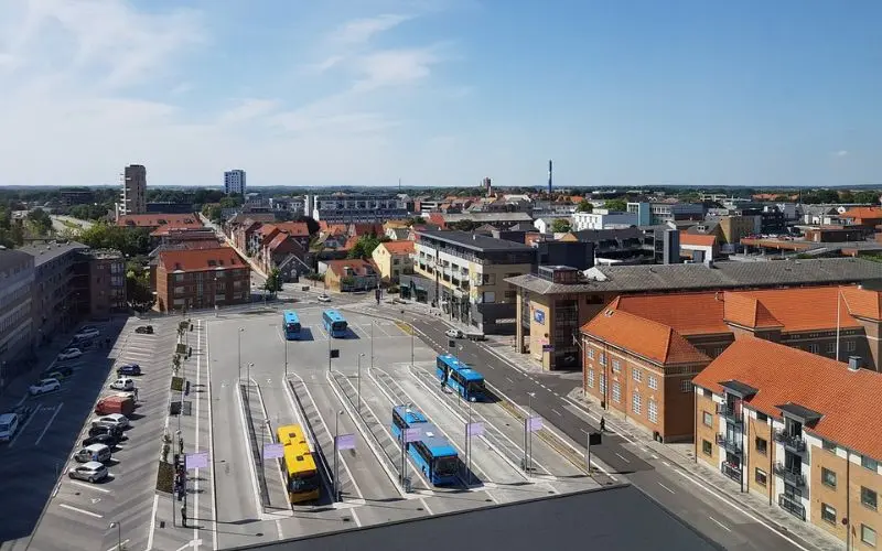Herning, Denmark city center with bus station and rooftops.