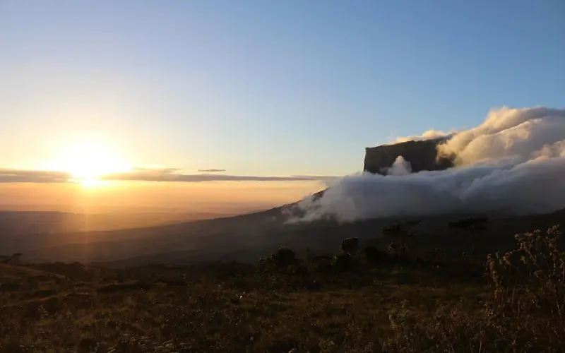 Venezuela has Mount Roraima at sunrise with clouds at its base.