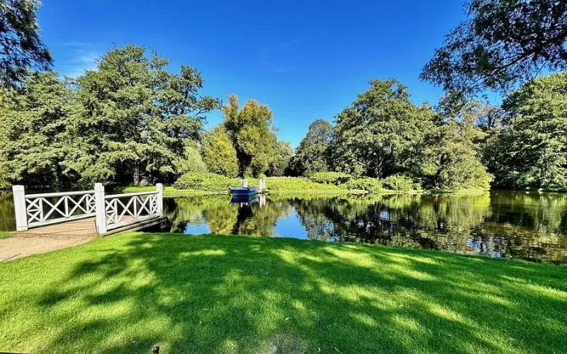 Frederiksberg Gardens in Denmark with lake and trees.