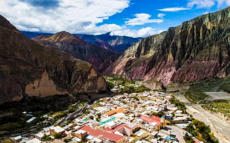 Argentina has a colorful mountain valley with a small town below.