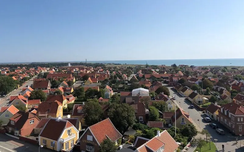 Skagen, Denmark coastal town with red-roofed houses.