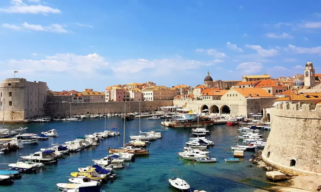 Boats docked in the historic harbor of Dubrovnik, Croatia.