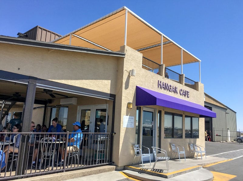 Hangar Cafe: Cozy dining in an aircraft hangar with plane-watching from the observation patio.